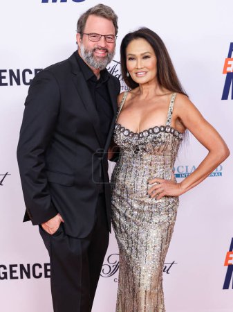 Photo for Paul Debevec and Tia Carrere arrive at the 31st Annual Race To Erase MS Gala 2024 held at the Fairmont Century Plaza on May 10, 2024 in Century City, Los Angeles, California, United States. - Royalty Free Image