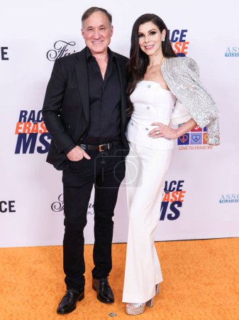 Photo for Terry Dubrow and wife Heather Dubrow arrive at the 31st Annual Race To Erase MS Gala 2024 held at the Fairmont Century Plaza on May 10, 2024 in Century City, Los Angeles, California, United States. - Royalty Free Image