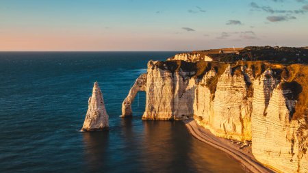 Photo for Panoramic view of the white coast of etretat france at sunset - travel concept - Royalty Free Image