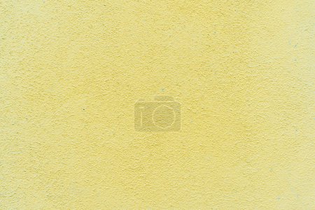 Téléchargez les photos : Détail de texture de mur en béton - fond de motif de surface en stuc naturel peint en couleur jaune - en image libre de droit