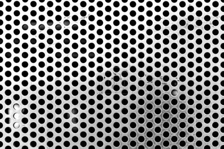 Foto de Primer plano de una rejilla metálica con pequeños agujeros redondos - fondo para su uso como textura - fondo con textura cromada - Imagen libre de derechos