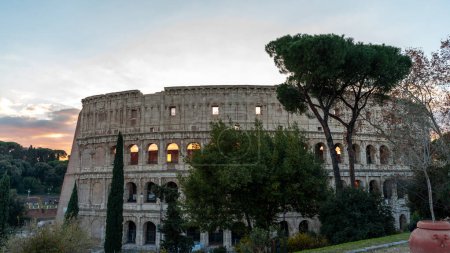 Photo for Panoramic view of the Colosseum Flavian amphitheater in Rome at sunset - Royalty Free Image