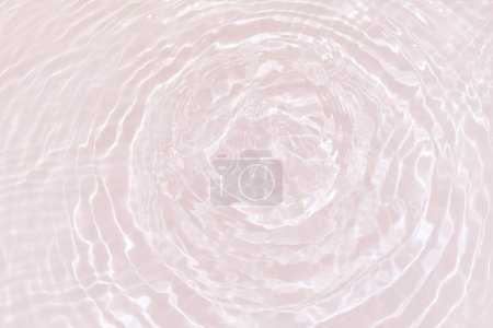Photo for Defocus blurred transparent gold colored clear calm water surface texture with splashes and bubbles. Trendy abstract nature background. Water waves in sunlight with copy space. Yellow watercolor shining - Royalty Free Image