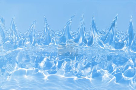 Defocus blurred transparent blue colored clear calm water surface texture with splashes and bubbles. Trendy abstract nature background. Water waves in sunlight with caustics. Blue water shinning