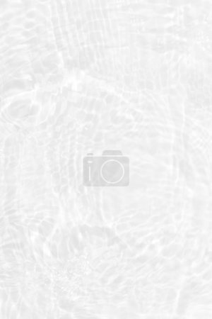 Photo for White water with ripples on the surface. Defocus blurred transparent white colored clear calm water surface texture with splashes and bubbles. Water waves with shining pattern texture background. - Royalty Free Image