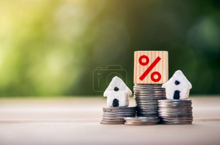 Mortgage rates business concept of investment housing real estate interest rates 3d home appraisal. planning savings money of coins to buy a home concept for property ladder, mortgage, real estate.