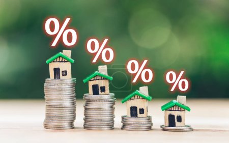 Foto de Mortgage rates business concept of investment housing real estate interest rates 3d home appraisal. planning savings money of coins to buy a home concept for property ladder, mortgage, real estate. - Imagen libre de derechos