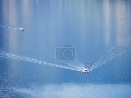 Photo for Tour boats high angle aerial view crossing Konigssee lake waters in Bavaria, Germany - Royalty Free Image