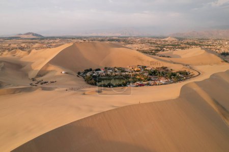 Photo for Aerial sunset photo of desert oasis Huacachina, Ica, Peru, South America. High quality photo - Royalty Free Image