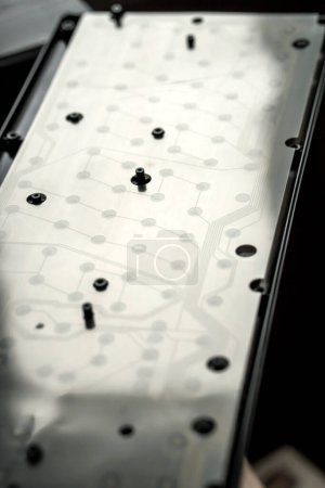 Photo for Repair, cleaning the keyboard. disassembled black keyboard, flexible keyboard membrane. - Royalty Free Image