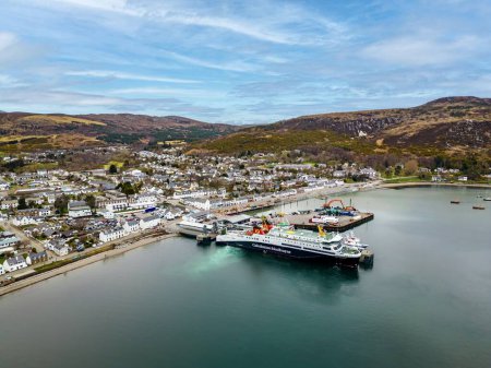 Photo for Aerial view of CalMac ferry MV Loch Seaforth in Ullapool Harbour, Scotland. - Royalty Free Image