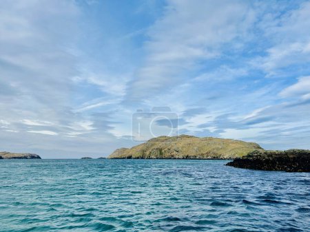Beautiful Loch Rog with turquoise lagoon waters surrounding Pabaigh Mor island. Paddling around Scottish Outer Hebrides islands. High quality photo