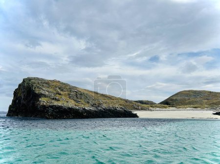 Beautiful Loch Rog with turquoise lagoon waters surrounding Pabaigh Mor island. Paddling around Scottish Outer Hebrides islands. High quality photo