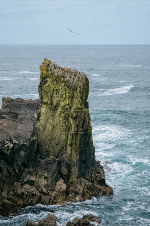 Rocky cliffs over Atlantic Ocean off coast of Isle of Lewis, Outer Hebrides of Scotland.