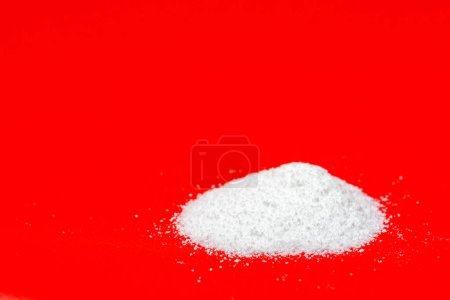 Photo for Pile of powdered Mannose isolated on red background used to prevent Bladder Infections - Royalty Free Image