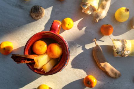 Photo for A Basic ingredients to prepare a Mexican fruit punch, a hot drink that is traditionally consumed during the December season at posadas and Christmas celebrations - Royalty Free Image