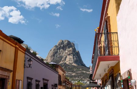 A Bernal Magic Town, monolith in Queretaro, Mexico, buildings, and the mountain in the background, with space for text