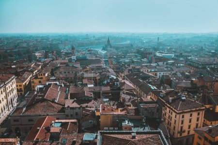 Photo for Sunny day in old city Verona, Italy. View from above on red roofs, streets and landmarks. Vacation in Europe. Historical buildings. - Royalty Free Image