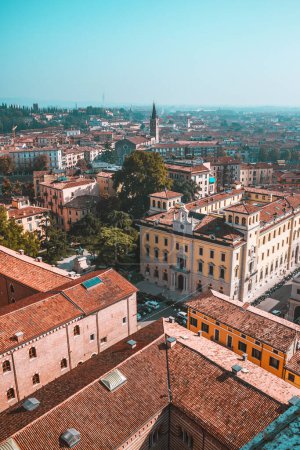 Photo for Sunny day in old city Verona, Italy. View from above on red roofs, streets and landmarks. Vacation in Europe. Historical buildings. - Royalty Free Image