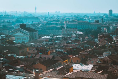 Photo for Sunny evening in old city Verona, Italy. View from above on red roofs, streets and landmarks. Vacation in Europe. Historical buildings. - Royalty Free Image