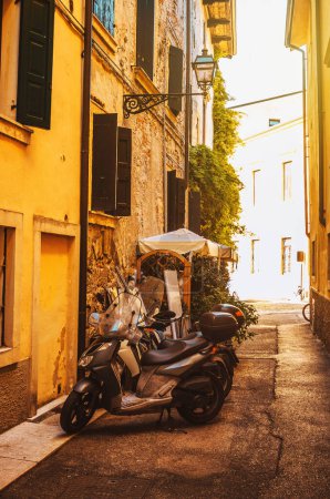 Photo for Traditional Italian houses with shutters. Sunny day in the historic center of Verona. Street landscape. High quality photo - Royalty Free Image