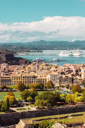 Photo for Panoramic view of the city on the island of Corfu in Greece. Port with ships, the sea and the streets of the old city in the light of the sun. High quality photo - Royalty Free Image