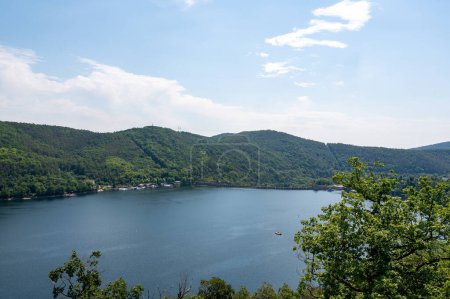 View of the Staimauer from Lake Edersee with blue sky and clouds, in Hesse, Germany