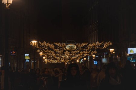 Photo for 3.12. 2022 - Krakow. Christmas decoration over the streets with light chains to celebrate Christmas holidays of Krakow, Poland. - Royalty Free Image