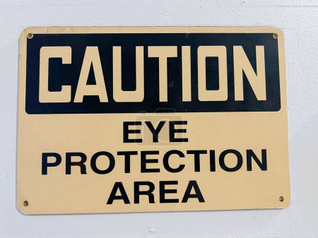 Photo for Caution Eye Protection required in this area sign. High quality photo - Royalty Free Image