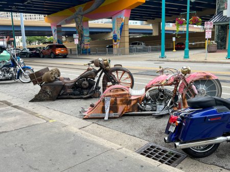 Photo for MILWAUKEE, WISCONSIN, JULY 15 2023: Downtown Milwaukee with retro customized Harley Davidsons parked outside an underpass in the city of Harley Davidson. High quality photo - Royalty Free Image