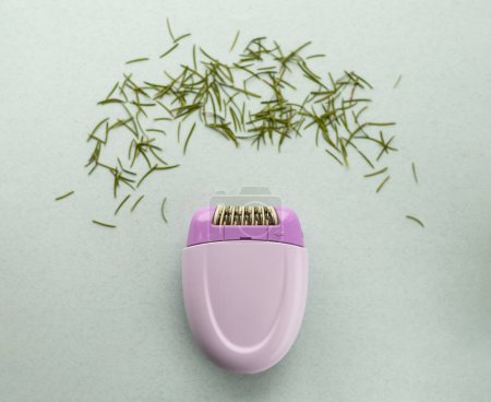 purple epilator with needle needles, concept of shaving, hair removal