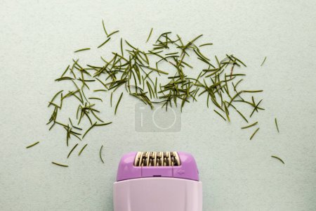 purple epilator with needle needles, concept of shaving, hair removal