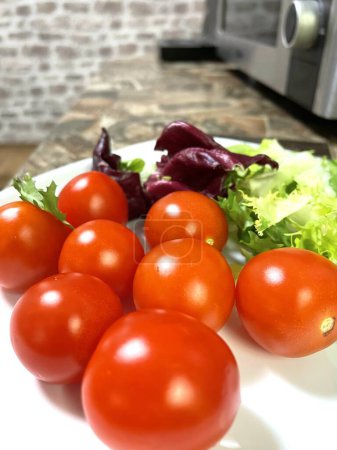 Photo for Salad, greens, benefit, useful, tomatoes, vitamins, spring, plate, table, kitchen, bright, food, eat, green, red, Ukrainian, Ukraine, kitchen, cook, tasty, beautiful, wonderful - Royalty Free Image