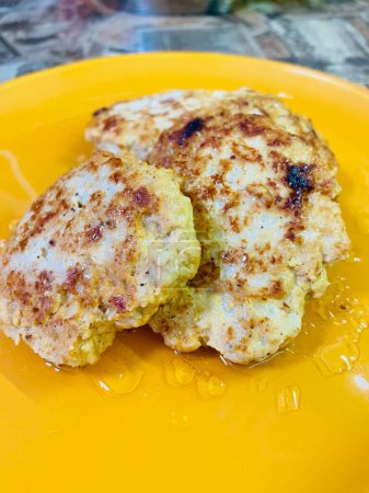 Photo for Chicken, cutlets, balls, meat, at home, kitchen, food, eat, delicious, calories, oil, fire, gas, stove, frying pan, crackles, oil, fat, plate, table - Royalty Free Image
