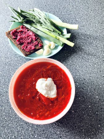 Photo for Borscht, red, plate, food, eat, table, plate, sour cream, onion, garlic, bread, Ukrainian, Ukraine, delicious, national - Royalty Free Image