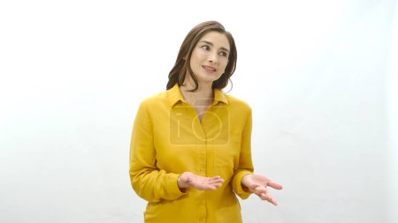 Photo for Woman speaking to a corner of the screen.The woman speaks with something imaginary,asks questions, is surprised by what she says. Creative people can put whatever they want where the woman is looking. - Royalty Free Image