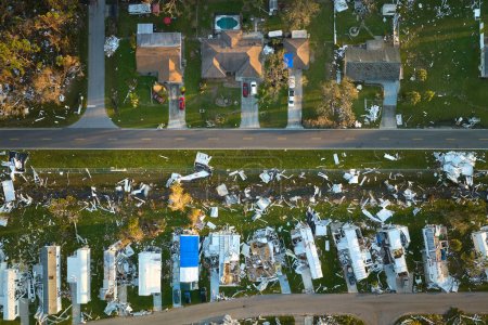 Badly damaged mobile homes after hurricane Ian in Florida residential area. Consequences of natural disaster.
