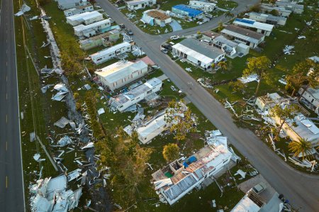 Photo for Severely damaged houses after hurricane Ian in Florida mobile home residential area. Consequences of natural disaster. - Royalty Free Image