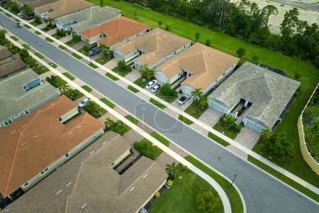 Photo for Aerial view of tightly packed homes in Florida closed living clubs. Family houses as example of real estate development in american suburbs. - Royalty Free Image