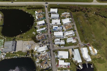 Photo for Badly damaged mobile homes after hurricane Ian in Florida residential area. Consequences of natural disaster. - Royalty Free Image