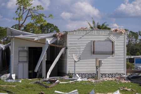 Destroyed by hurricane suburban houses in Florida mobile home residential area. Consequences of natural disaster.