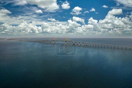 Aerial view of Sunshine Skyway Bridge over Tampa Bay in Florida with moving traffic. Concept of transportation infrastructure.