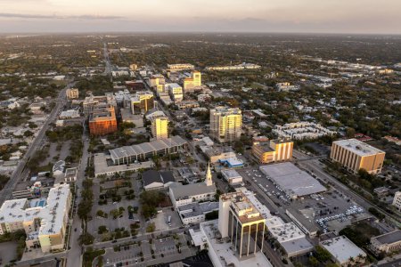 Sarasota, Florida at sunset. American city downtown architecture with high-rise office buildings. Real estate development in Florida. USA travel destination.