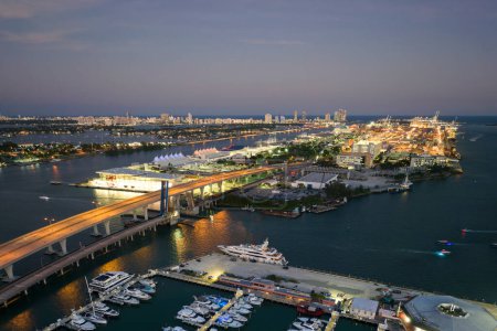 Miami marina bay with luxury sailboats. Expensive yachts and motorboats docked in Biscayne Bay harbor in Brickell downtown.