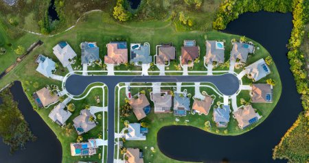 Aerial view of spacious family houses in Florida suburban area. Real estate development in American suburbs.