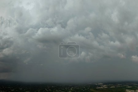 Photo for Stormy cumulus clouds forming during heavy thunderstorm on dark sky. Moving and changing cloudscape weather. - Royalty Free Image