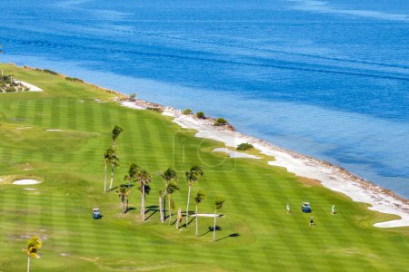 Big golf course field with green grass in Boca Grande, small town on Gasparilla Island in southwest Florida.