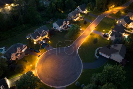 Top view of expensive two story private houses in Rochester NY suburbia at night. New family homes in upscale community. Real estate development in american suburbs.