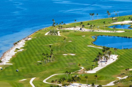 Waterfront golf course in Florida. Sports grounds with green grass in Boca Grande, small town on Gasparilla Island.