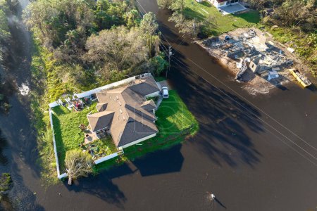 Aftermath of natural disaster. Flooded houses by hurricane rainfall in Florida residential area.